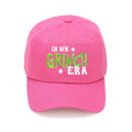 In my Grinch Era Cap: Hot Pink