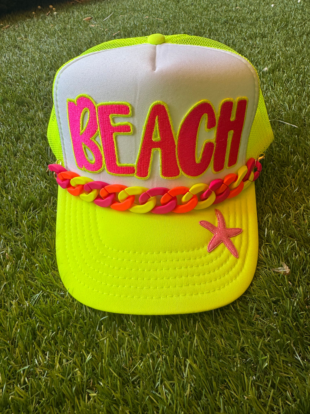 BEACH hot pink with neon trim embroidered patch on neon trucker hat with neon hat chain