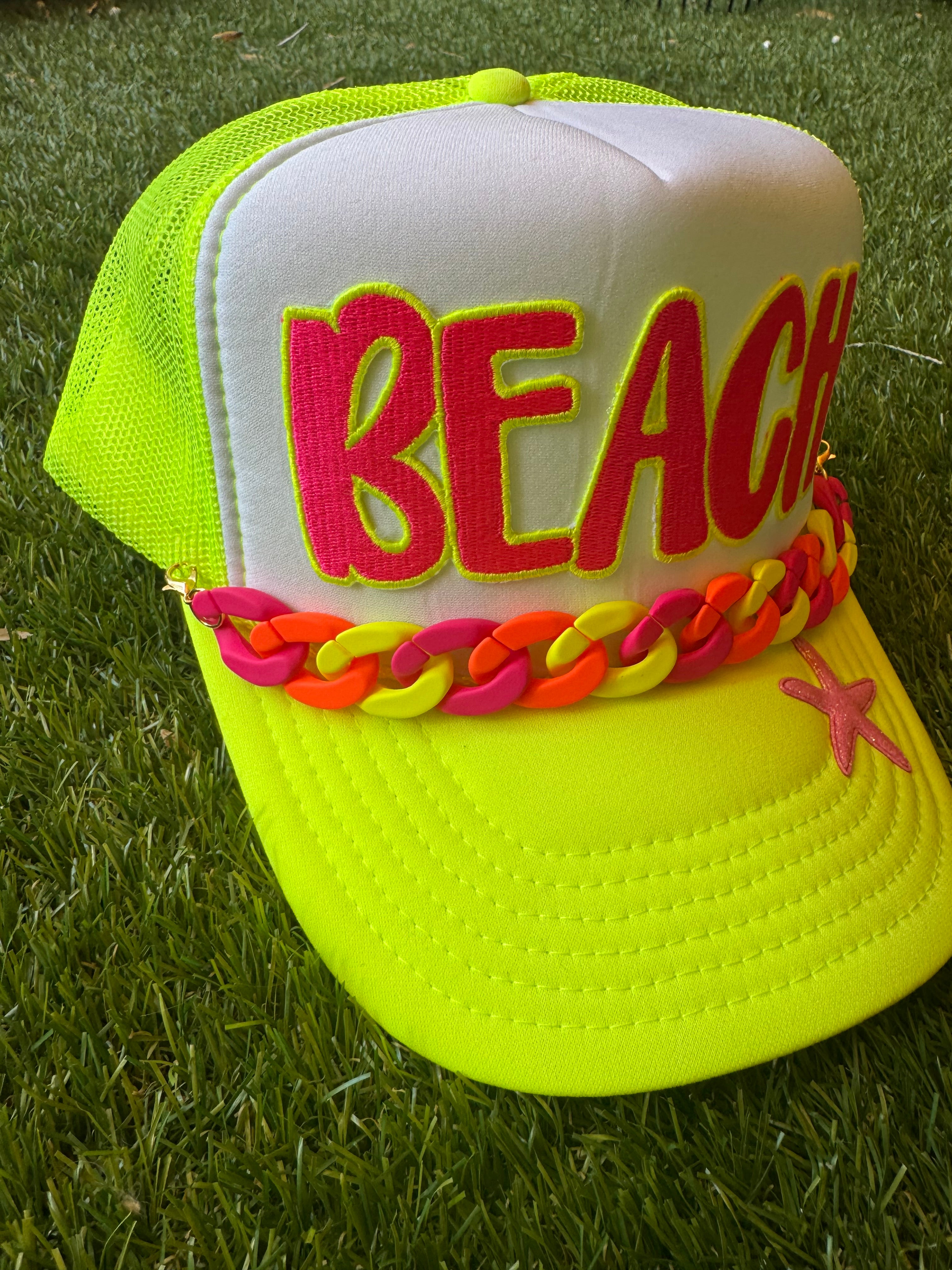 BEACH hot pink with neon trim embroidered patch on neon trucker hat with neon hat chain