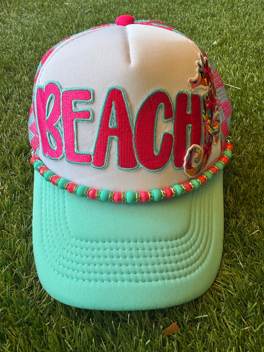 BEACH hot pink with teal trim on teal and hot pink trucker hat with hat chain and seahorse embroidered patch