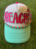 BEACH hot pink with teal trim on teal and hot pink trucker hat with hat chain and seahorse embroidered patch
