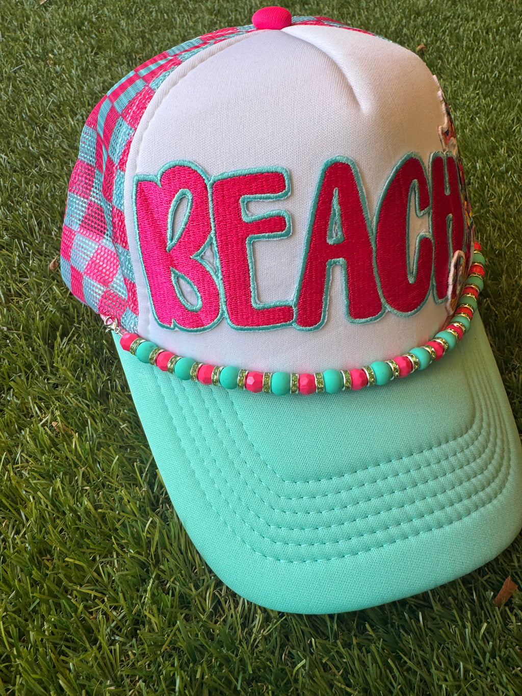BEACH hot pink with teal trim on teal and hot pink trucker hat with hat chain and seahorse embroidered patch