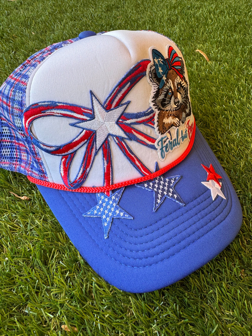 Feral but Free with large USA theme bow trucker hat