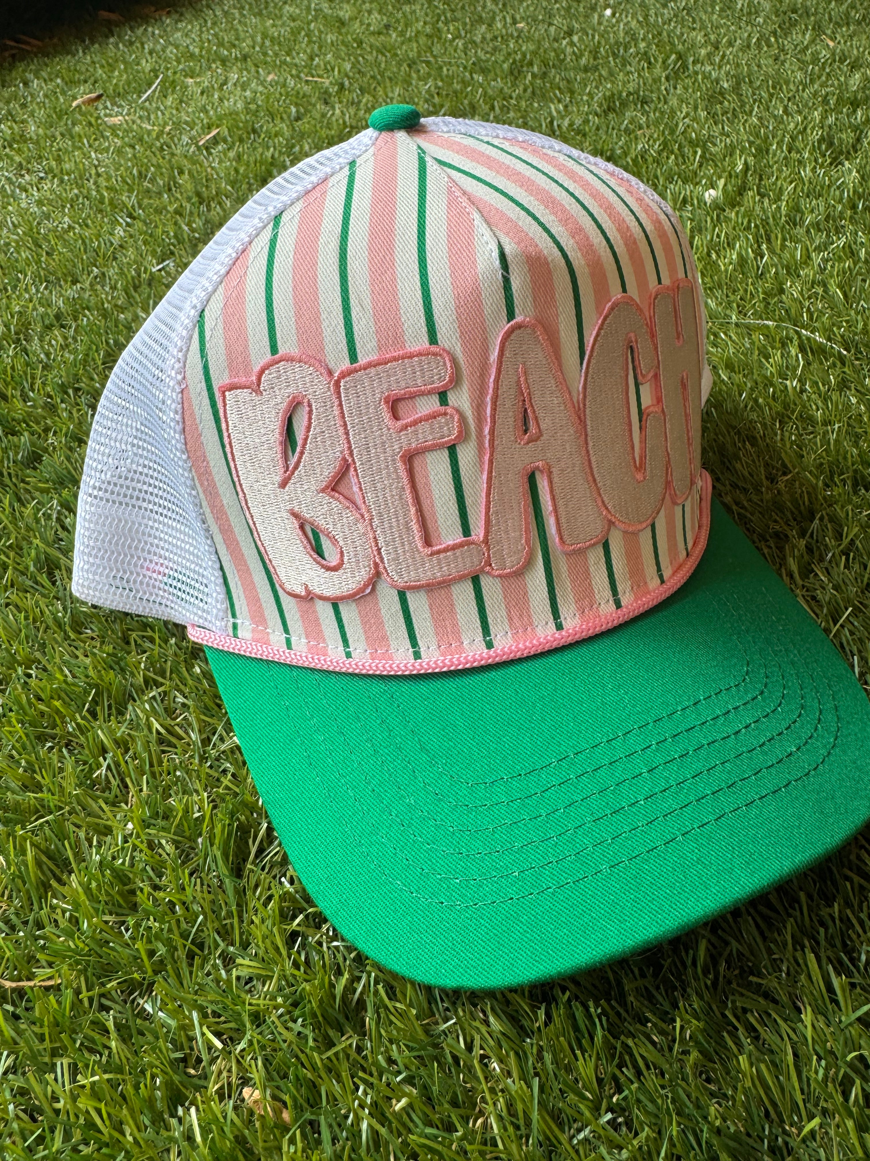 BEACH embroidered patch on green and pink strip hat