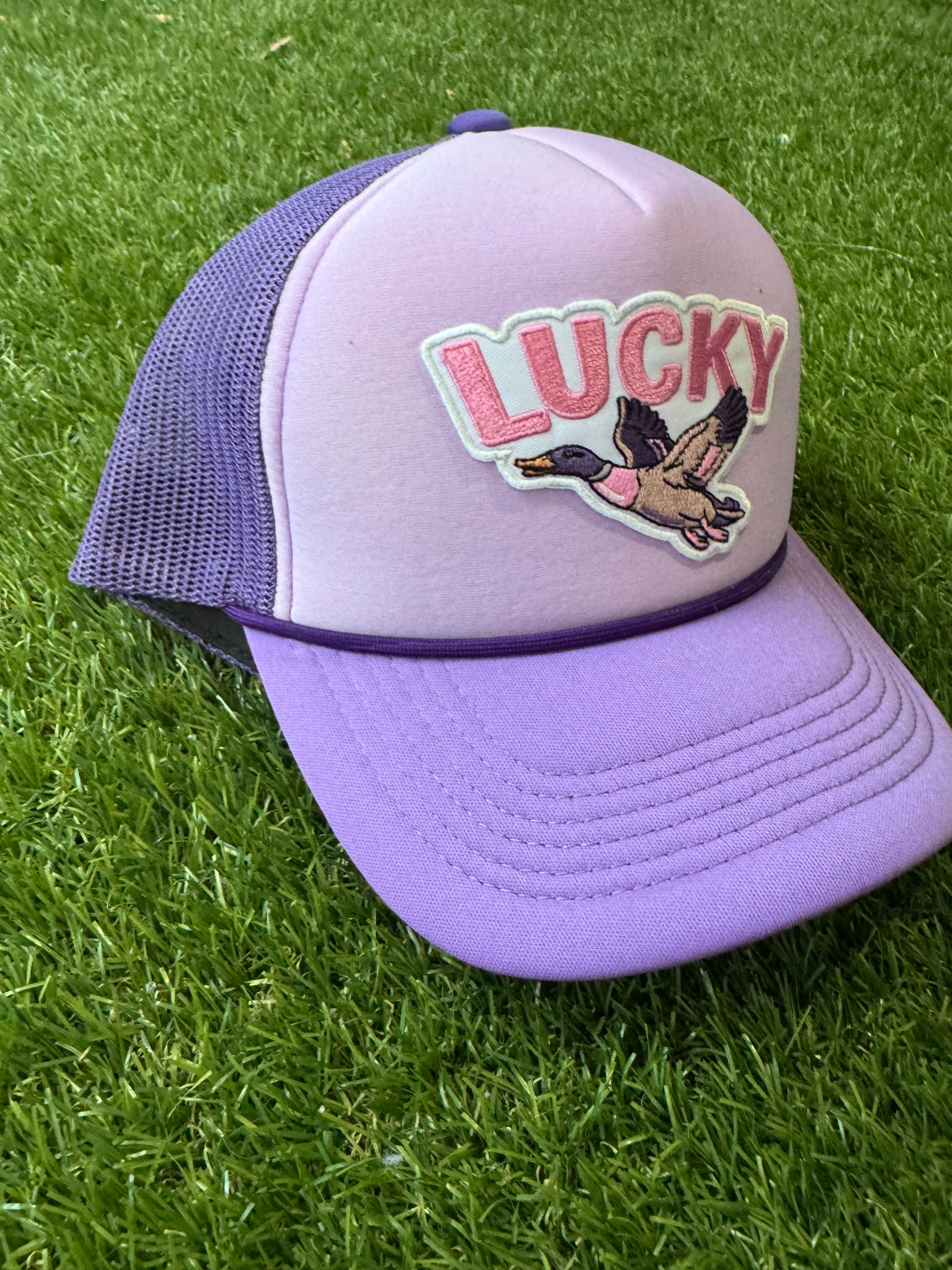Lucky Duck on tricolor purple mesh trucker hat with magna pony