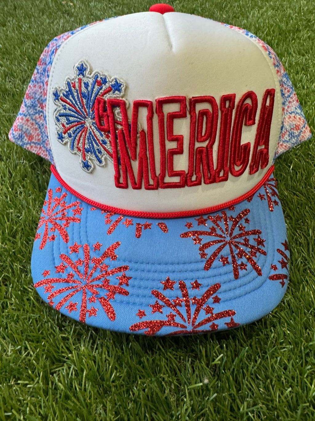 'Merica embroidered patch with fireworks on red, white and blue trucker hat