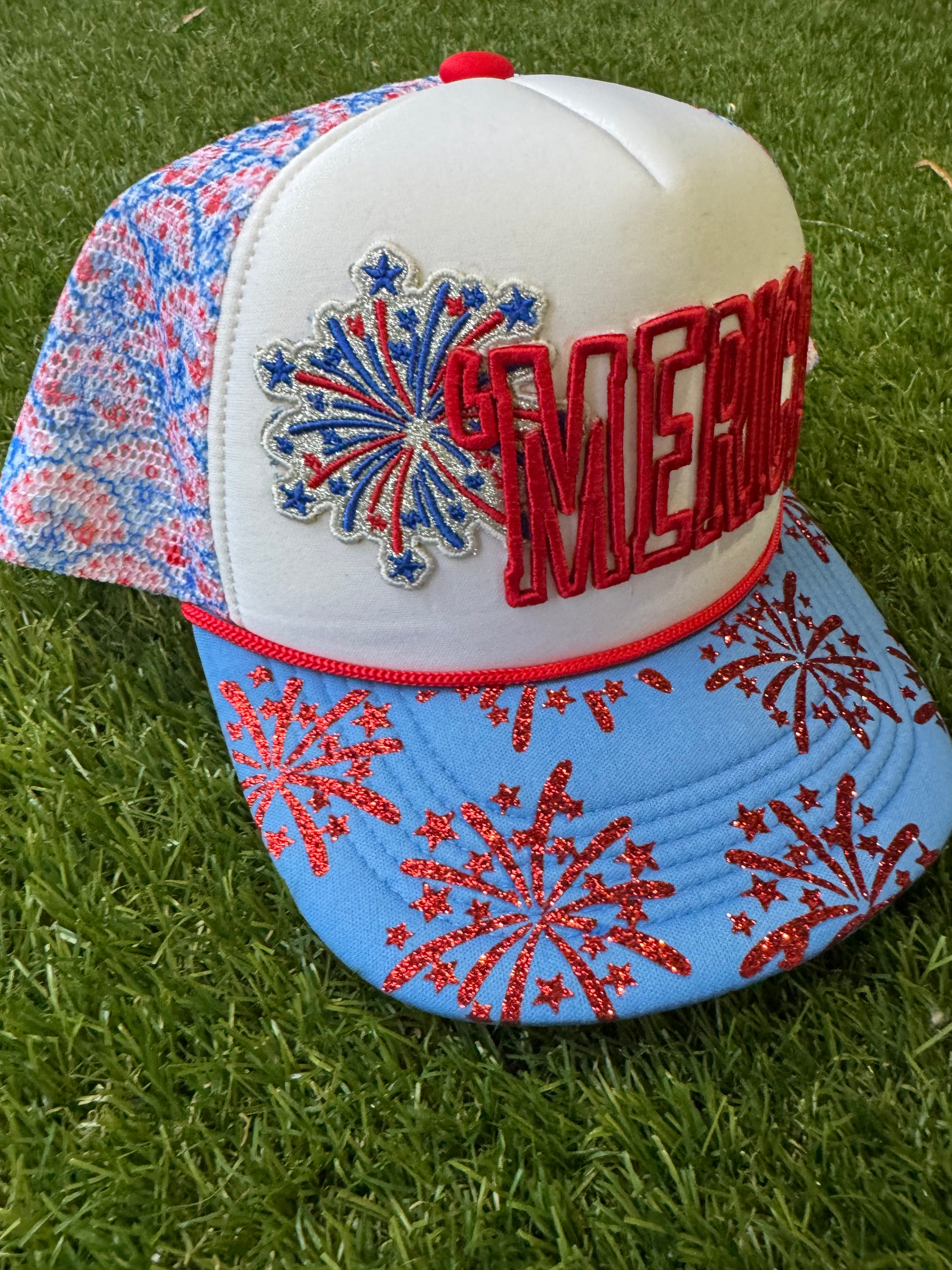 'Merica embroidered patch with fireworks on red, white and blue trucker hat