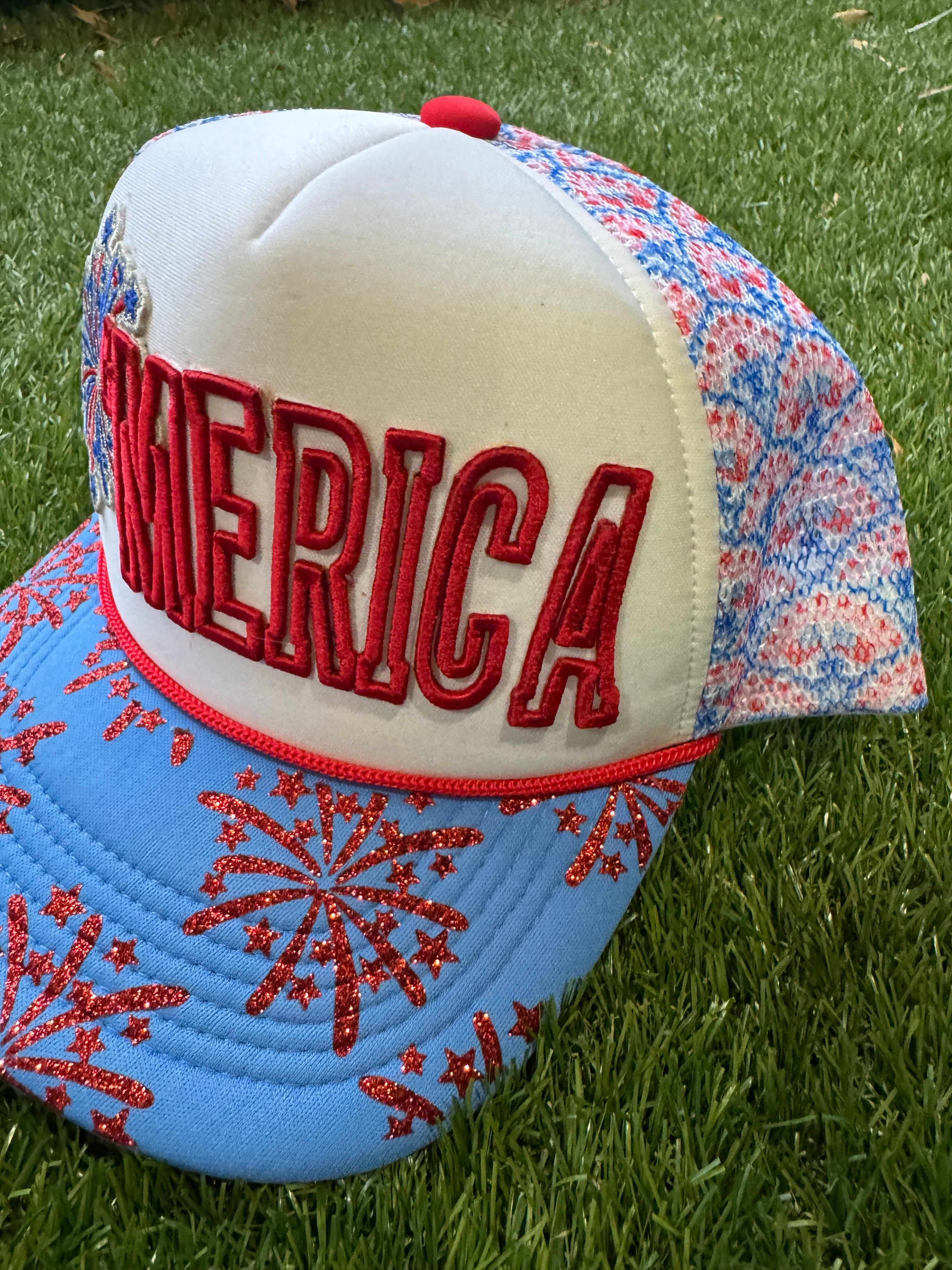 'Merica embroidered patch with fireworks on red, white and blue trucker hat