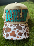 Darlin' embroidered patch on canvas cow brim trucker hat