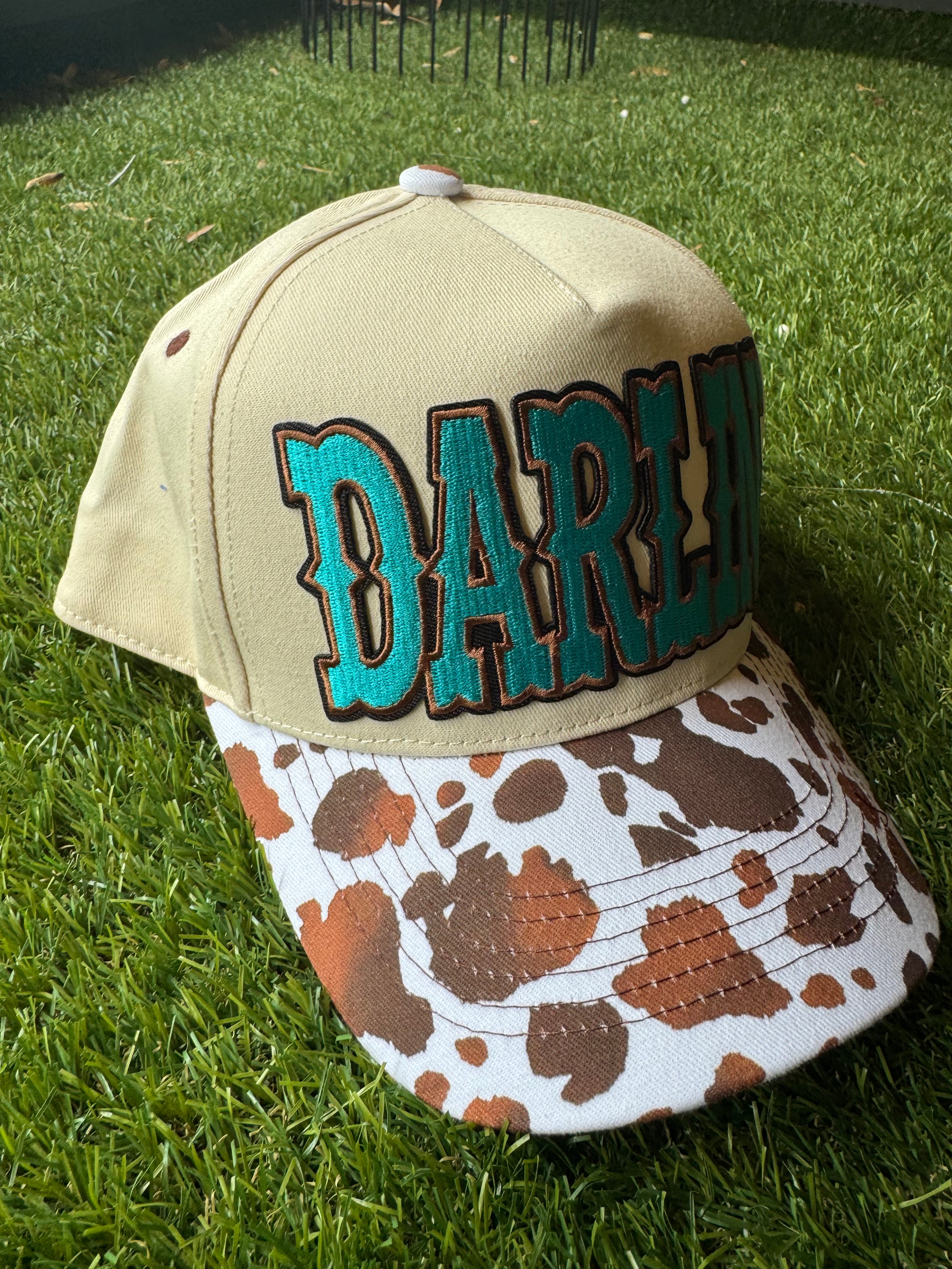 Darlin' embroidered patch on canvas cow brim trucker hat