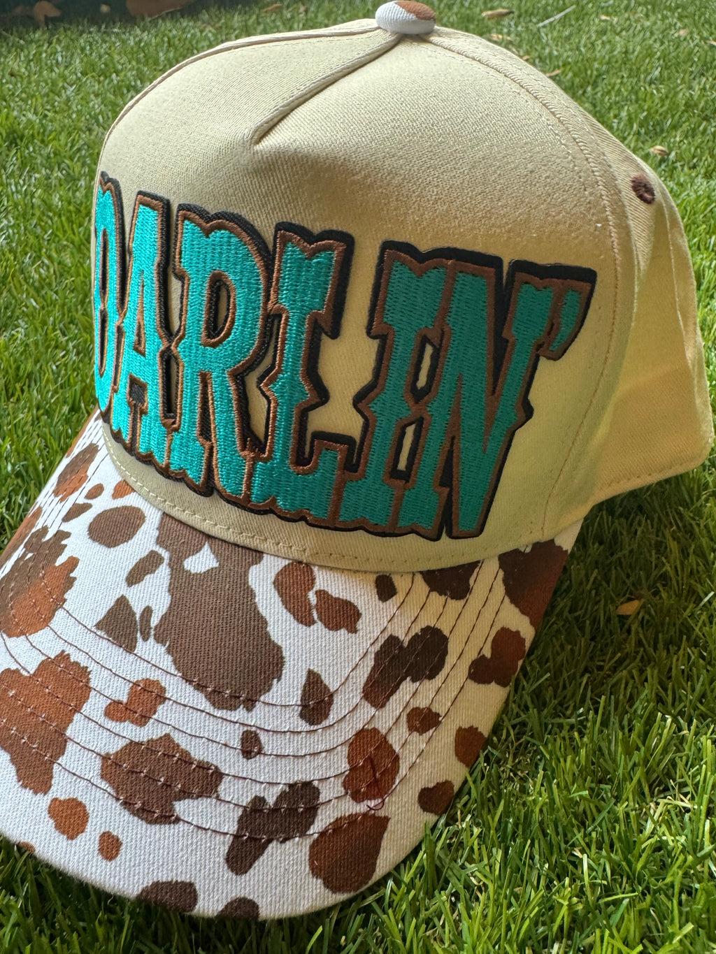 Darlin' embroidered patch on canvas cow brim trucker hat