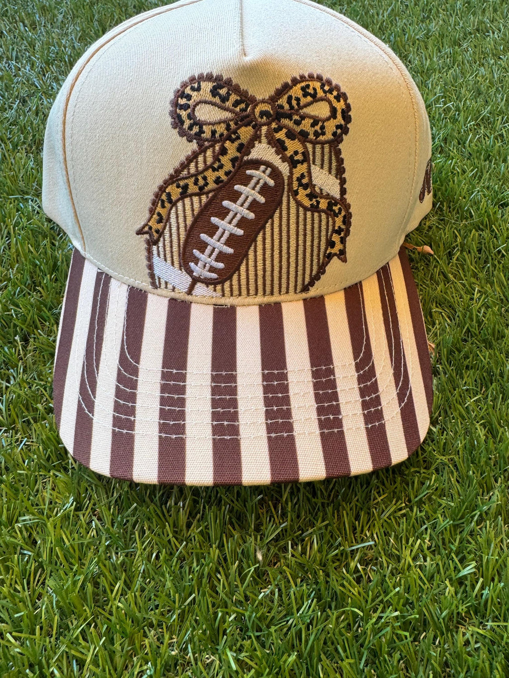 Football with leopard bow